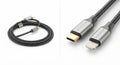 Câble USB-C vers Lightning noir tressé en fibre de Kevlar avec connecteurs en aluminium gris et or, résistant et durable.