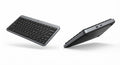 Clavier bureautique sans fil compact gris foncé avec touches noires, profil fin, design moderne et connectivité USB.