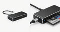 Lecteur de Cartes Mémoire externe USB en aluminium gris foncé avec câble USB-C tressé intégré pour transfert rapide.