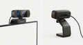 Webcam Full HD 1080p noire en plastique avec microphone intégré, support ajustable fixé sur écran d’ordinateur.